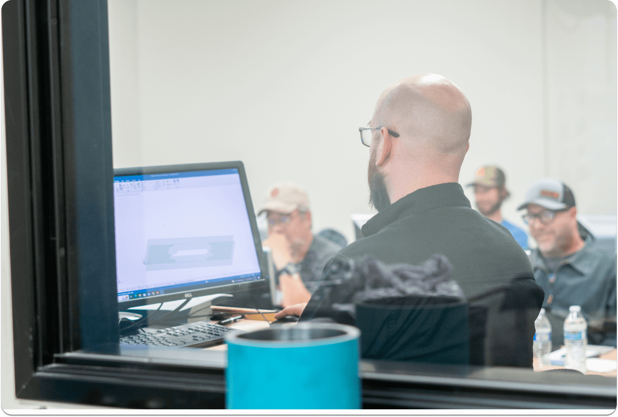 Flow employee seen training a classroom of customers