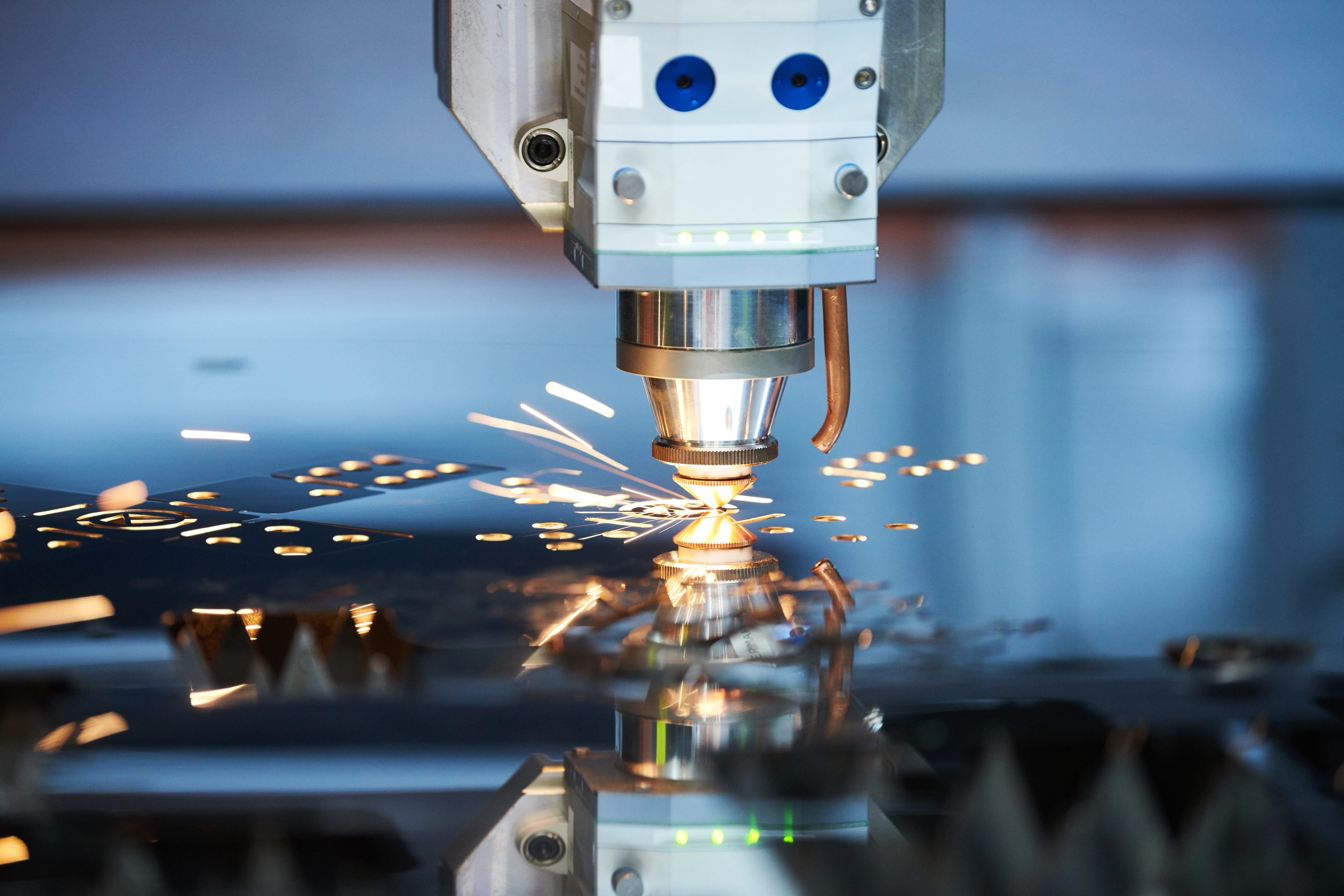 laser cutting semi-reflective metal and sparks flying