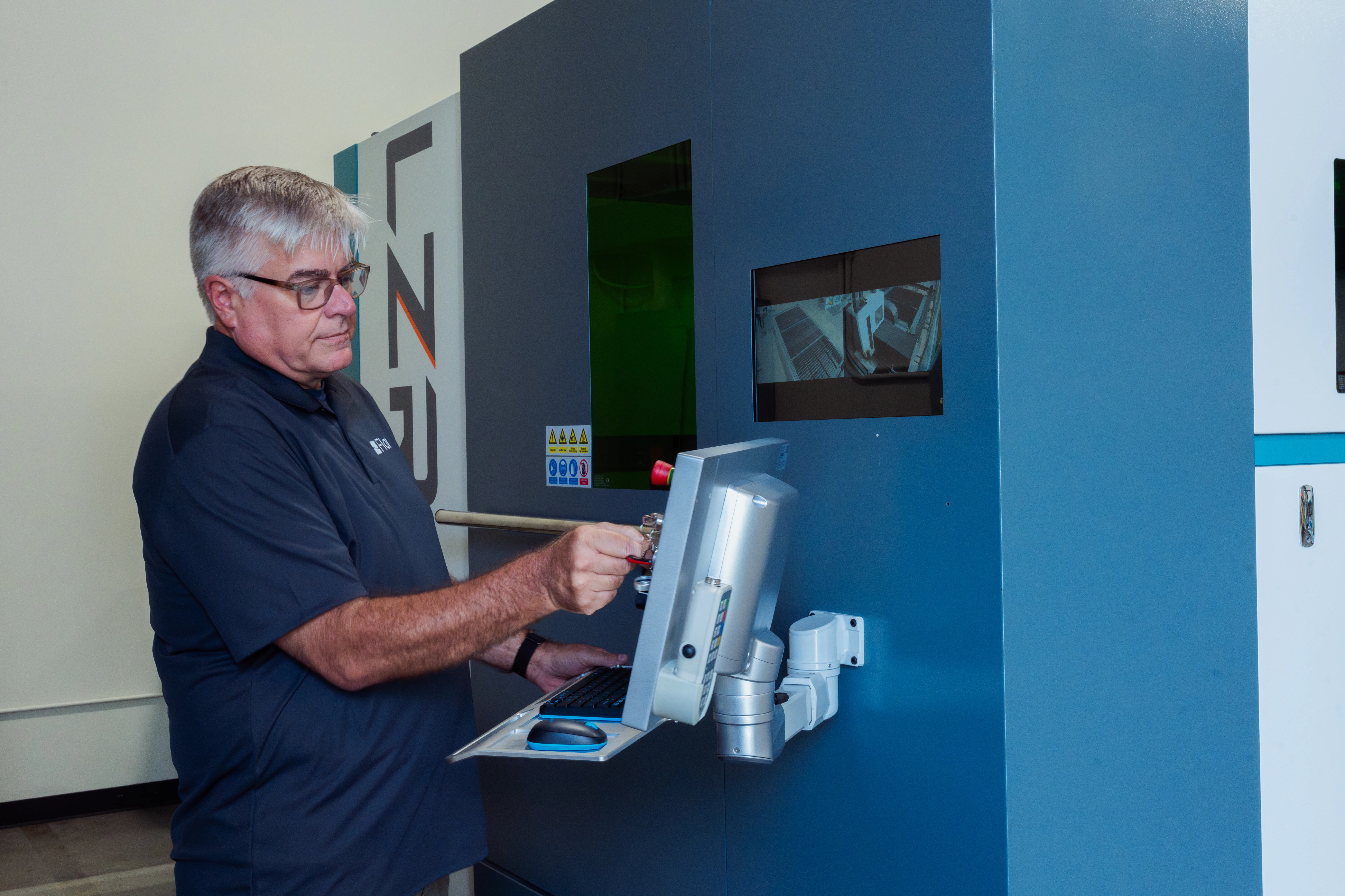 Technician troubleshooting an LZR system