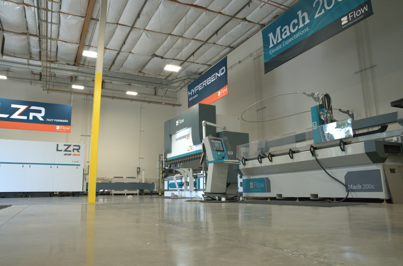 ground-level point of view of a shop floor with an LZR, HyperBend, and Mach 200c waterjet installed
