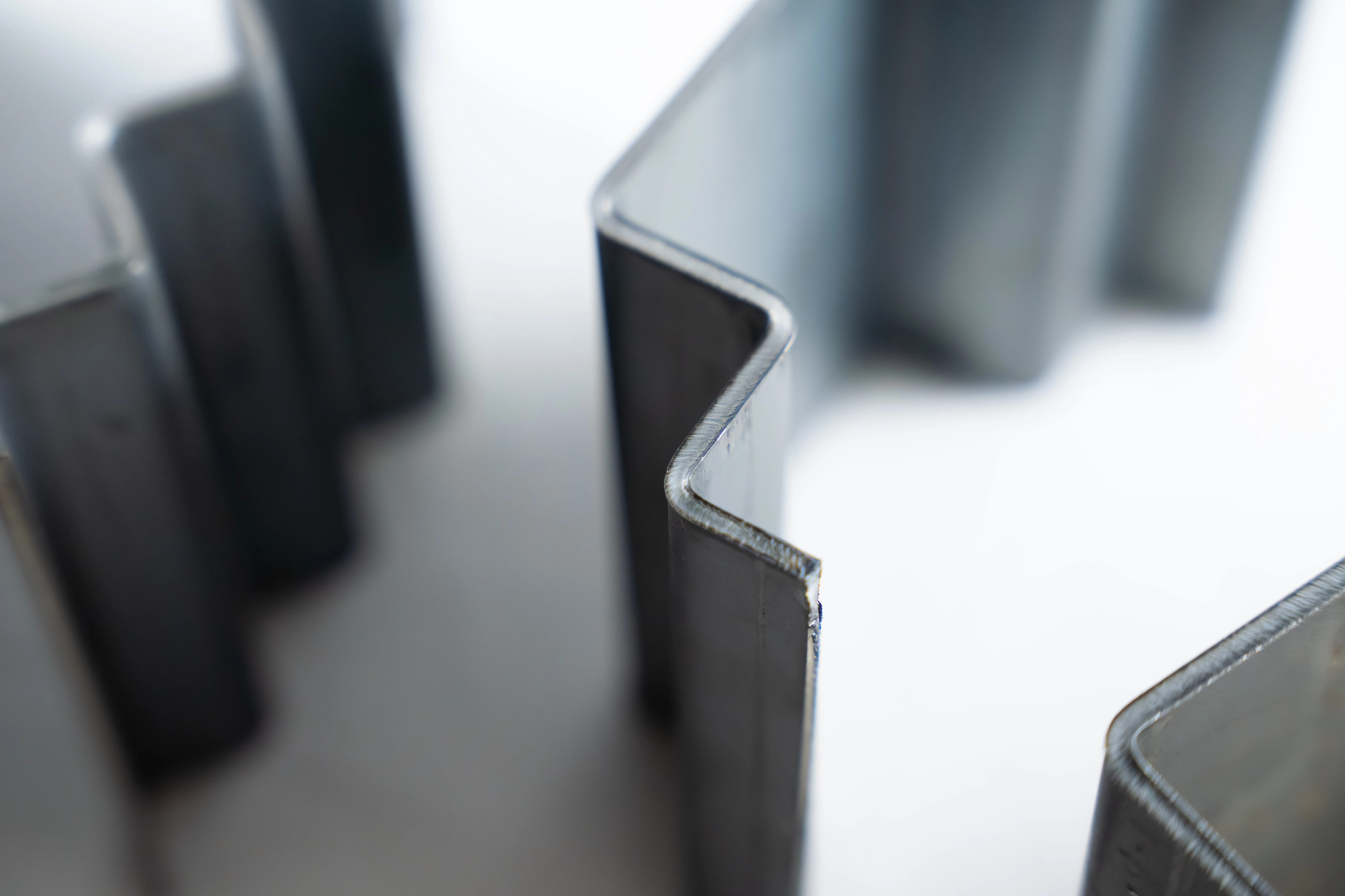 thin metal parts that have been bent with multiple right degree angles